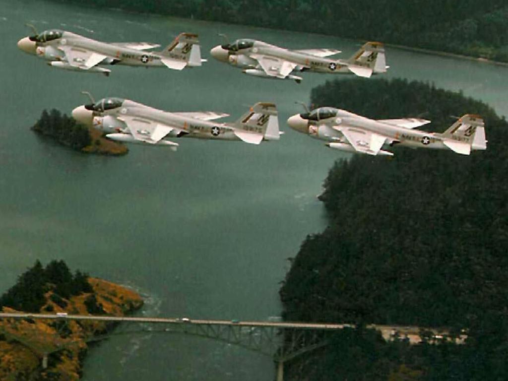 Four A-6s flying through deception pass wallpaper
