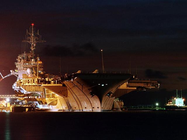 USS Kitty Hawk at night wallpaper